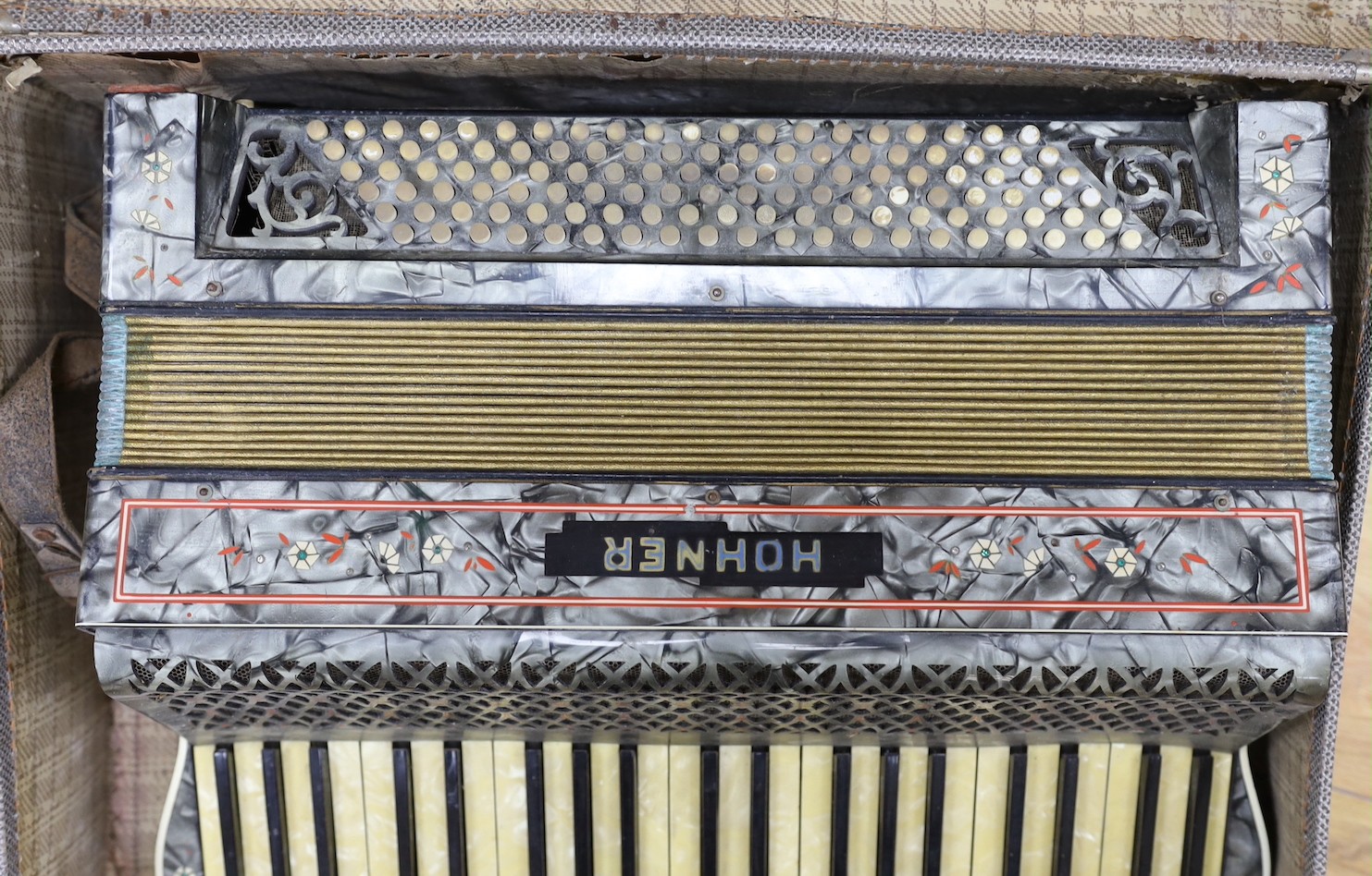 A cased Hohner accordion, Case 57cms wide.